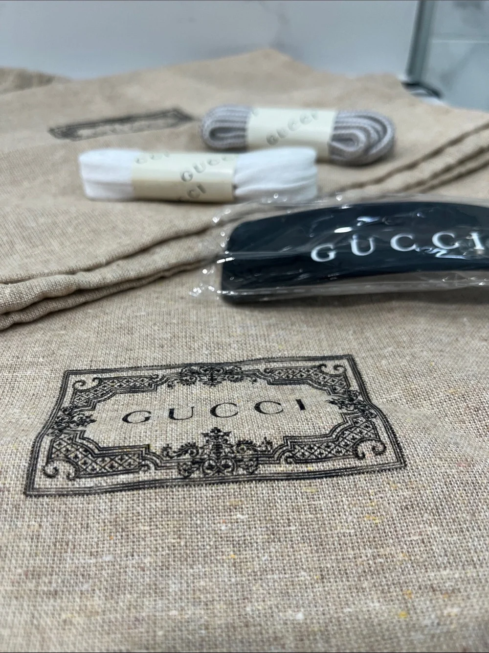 Gucci Beige Branded Dust Bags with Black Strap and White/Gray Laces